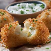 Deep-Fried Potato Round · House cut round potatoes coated in batter then deep-fried!