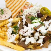 House Special · Chicken or lamb and beef over french fries, served with Greek salad, hummus, pita and soda.