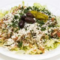 Greek Salad · Lettuce, cucumbers, onions, tomatoes, feta cheese, olives and vinaigrette.