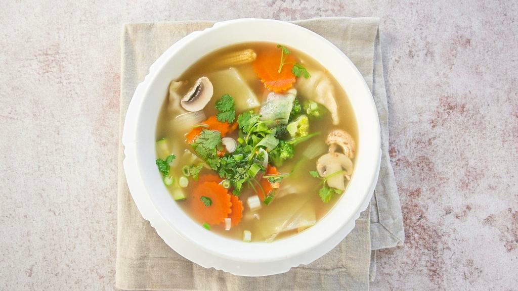 Dumpling Soup · Your choice of chicken or vegetarian dumplings, onion, cabbage, carrots, broccoli, zucchini, mushroom, celery, and cilantro.
