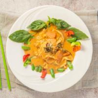 Panang Curry · Panang curry paste, coconut milk, carrot, bell pepper, sweet pea, Thai basil, and topped wit...
