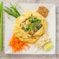 Pad Thai · World famous rice noodles stir fried with carrot, garlic leaf, bean sprouts, crushed peanuts...