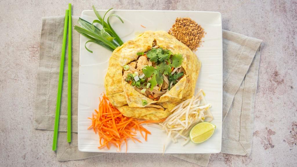 Pad Thai · World famous rice noodles stir fried with carrot, garlic leaf, bean sprouts, crushed peanuts, cilantro, your choice of protein.