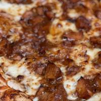Bbq Pizza · Tender BBQ chicken breast or pork, onions, Parmesan cheese and mozzarella cheese. Served wit...