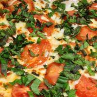 Margherita Pizza · Tomatoes, fresh garlic, fresh basil and mozzarella cheese.