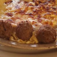 Baked Fettuccine With Meatballs · Fettuccine noodles in creamy Alfredo sauce with feta, Parmesan and mozzarella cheese.