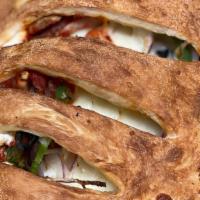Vegitariano Calzone · Green peppers, black olives, mushrooms and red onions. Vegetarian.