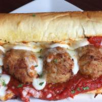 Meatball Parmigiano Sandwich · Homemade meatballs, mozzarella and Parmesan cheese on French bread with our homemade marinar...