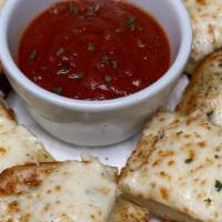 Cheese Bread · Garlic cheese bread topped with mozzarella and Parmesan cheese. Homemade marinara sauce.