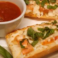 Margarita Bread · Garlic bread topped with tomatoes, fresh basil, mozzarella, Parmesan cheese and marinara sau...