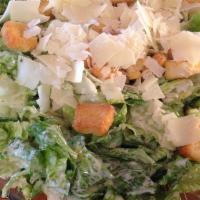 Caesar Salad · Romaine lettuce tossed with Caesar dressing, croutons, Parmesan cheese and lemon wedge.