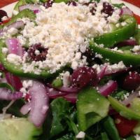 Italian Salad · Mixed greens, tomatoes, cucumbers, green peppers, Kalamata olives, feta cheese and onions wi...