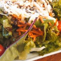 Insalata Della Casa · One size only. Mixed greens, cucumbers, tomatoes, black olives, mozzarella and your choice o...