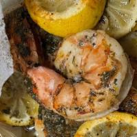 Shrimp En Papillote · Colossal shrimp seasoned and baked to perfection in parchment paper, root vegetables garnish...