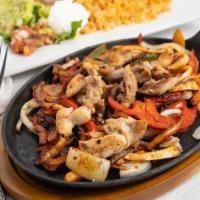 Fajitas · veggie fajita mix and choice of meet, served with rice and beans on side. lettuce sour cream...