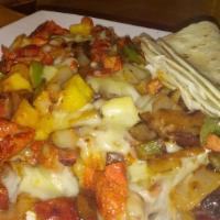 Alambre Pastor · pastor meat, onions, bell peppers, bacon served with melted cheese. choice of corn or flour ...