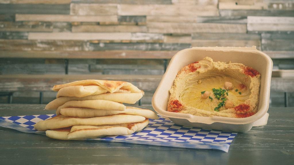 Hummus & Pita · Garbanzo dip prepared with Tahini, garlic, and lemons. Served with 2 Pitas. *Vegan.