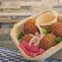 Falafel (4) · Deep fried Garbanzo and Fava beans. Served with Tahini. 4 pieces. *Vegan and Gluten Free.