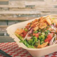Fattoush · Diced lettuce, tomato, onions, cucumbers, bell peppers, fried Pita and dressing.