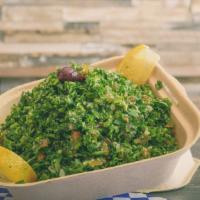 Tabbouleh · Italian parsley, onions, tomato, bulgar, lemon juice, and olive oil.