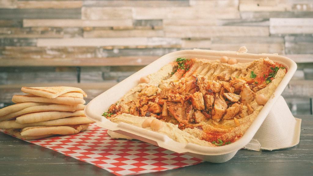 Meaty Hummus & Pita · Topped with choice of Gyro or Chicken Shawarma. Served with 2 Pitas.