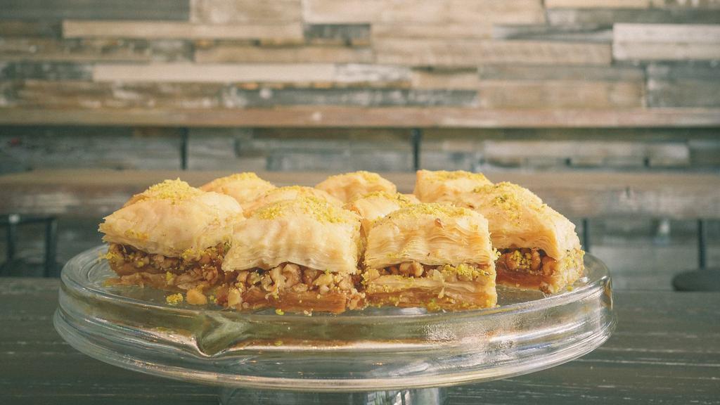 Baklava · Filo dough, simple syrup, and nuts. Baked layered filo dough stuffed with nuts and soaked with simple syrup.
