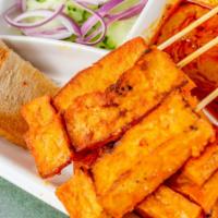 Vegetarian Satay · Vegetarian. Flame broiled tofu strips on bamboo skewers, served with curry peanut sauce and ...