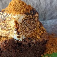 Lembas Brownie · Rich dark chocolate brownie served with a house made toasted marshmallow and graham streusel.