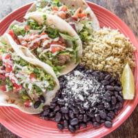 Taco Platter · Served on corn or flour tortillas with pico de gallo, avocado-lime creme, lettuce, and a sid...