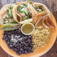 Traditional Mexican Taco Platter · Choice of protein, cilantro, chopped onion, tamatillo verde sauce. Served with 2 corn tortil...