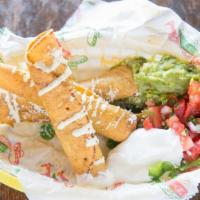3 Taquitos (Crispy Rolled Tacos) · Crispy corn tortillas stuffed with chicken adobo, carnitas, or potato and cheese. Served wit...