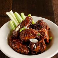 Jumbo Chicken Wings · Jumbo chicken wings or boneless chicken fritters tossed in you choice of Bogey's buffalo, sw...