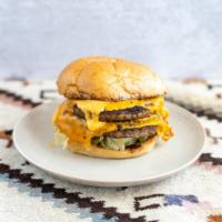 Monster Burger · Two 1/3 lb all beef pattie, double cheddar, sriracha mayo, shredded iceberg