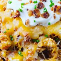 Mo Loaded Fries · Seasoned tries topped with meat (beef or chicken), nacho cheese, tomatoes, onions and sour c...