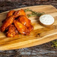 Garlic Parm Winner Wings · Our famous wings fried until perfectly golden. Tossed in house made garlic parmesan sauce, s...
