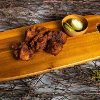 Sassy Spicy Korean Wings · Our famous wings fried until perfectly golden. Tossed in house made spicy korean sauce, serv...