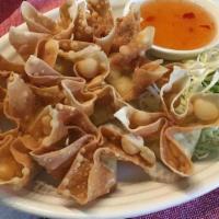Crab Delight · Crispy-fried wonton stuffed with crab meat and seasoned cream cheese, paired with plum sauce.
