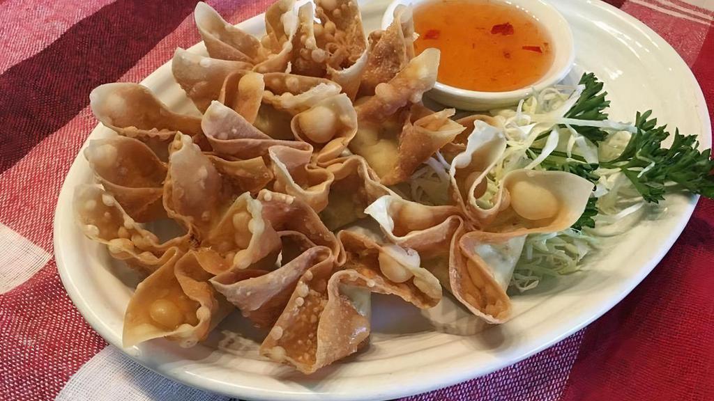 Crab Delight · Crispy-fried wonton stuffed with crab meat and seasoned cream cheese, paired with plum sauce.