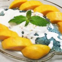 Mango & Sweet Sticky Rice · Fresh Ripen Mango serves with Signature Blue Sweet Sticky Rice with Coconut Milk topping.