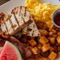 Classic Breakfast · Two eggs, bacon, grilled bread, crispy potatoes. 

These items are served cooked-to-order or...
