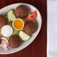 Falafel · Vegetarian.  Five fried  vegetable patties made of chickpeas and fava beans,  ground togethe...