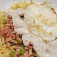 Country Breakfast Bowl · Seasoned hash browns with shredded cheddar jack cheese, ham, sausage, green bell pepper, oni...