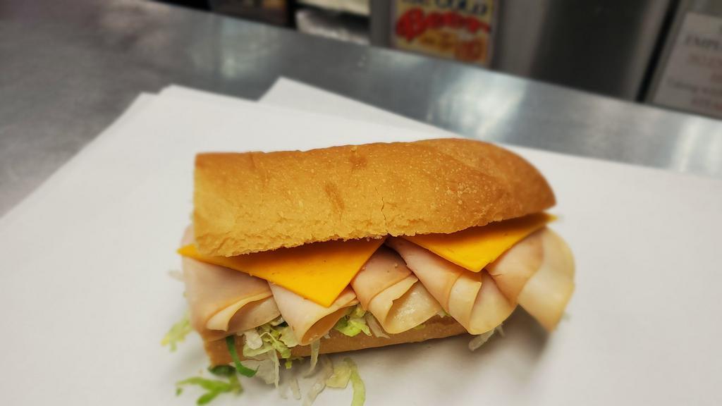 Turkey Sub · Sliced oven roasted turkey on fresh baked sub roll with your choice of cheese, dressings, and veggies.