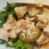 Chipotle Chicken Wrap · Fajita chicken, lettuce, jalapenos, shredded cheddar jack cheese, with our house-made chipot...