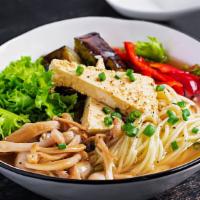 Veggie Ramen · Rich, clear vegetable broth with bouncy ramen noodles topped with bean sprouts, sweet corn, ...