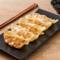 Chicken Dumplings-Gyoza (5) · Gyoza-style dumplings stuffed with minced chicken, garlic ginger and scallions. Pan-fried un...