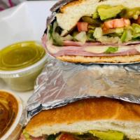Tortas · Mexican sandwich: fluffy bun spread with butter and topped with meat, lettuce, tomato, onion...
