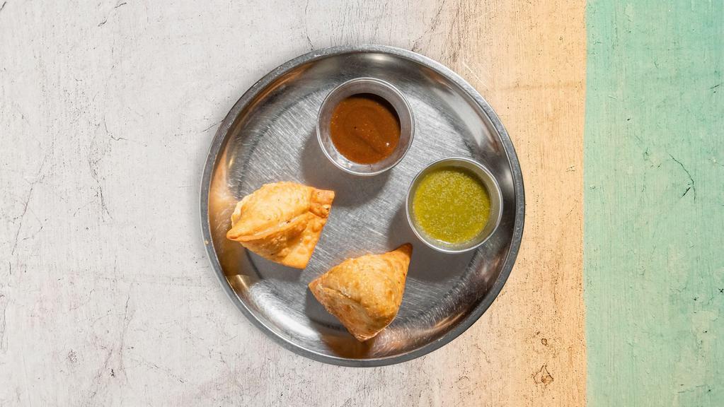 Samosas · Savory pastry filled with potatoes and peas and fried to perfection.