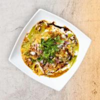 Samosa Chaat · vegetable Samosa topped, with Chana Masala, Onions Tomatoes, Yogurt, Cilantro, Tamarind Chut...