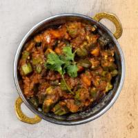 Bhindi Masala · Fresh okra with sliced onions, herbs and mild spices. Served with rice.